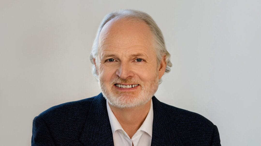 Mike-Cooney-headshot-Trade-Tech-scaled-e1742987958327-1080x606.jpg